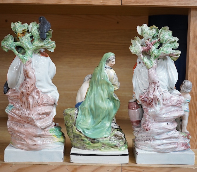 A pair of Ralph Wood II Staffordshire pearlware figures, ‘Widow’ and ‘Elijah’, c.1790-1800 an early 19th century pearlware group ‘Roman Charity’, (3) tallest 28cm. Condition - fair to good